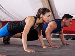 Man and woman doing pushups